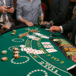 Busy blackjack table with players and a dealer.