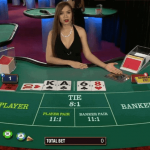 Baccarat table showing bets and live dealer.