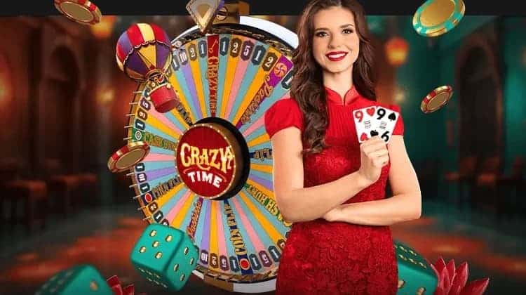 A live host holds two nine cards before the Crazy Time money wheel. Dice, chips, and a hot-air balloon fly around the host.