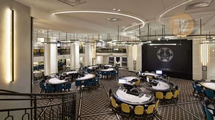 A spacious room with gambling tables in one of the high-class brick-and-mortar casinos in France.