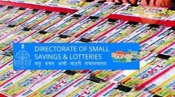 The emblem of the Directorate of Small Savings & Lotteries on the background of a stand with paper-back lottery tickets.