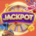 A Jackpot sign over a fast-rotating Money Wheel while the Aviator red plane and a train are speeding away.