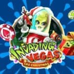 An alien Santa comes armed over a sign reading "Invading Vegas Las Christmas."